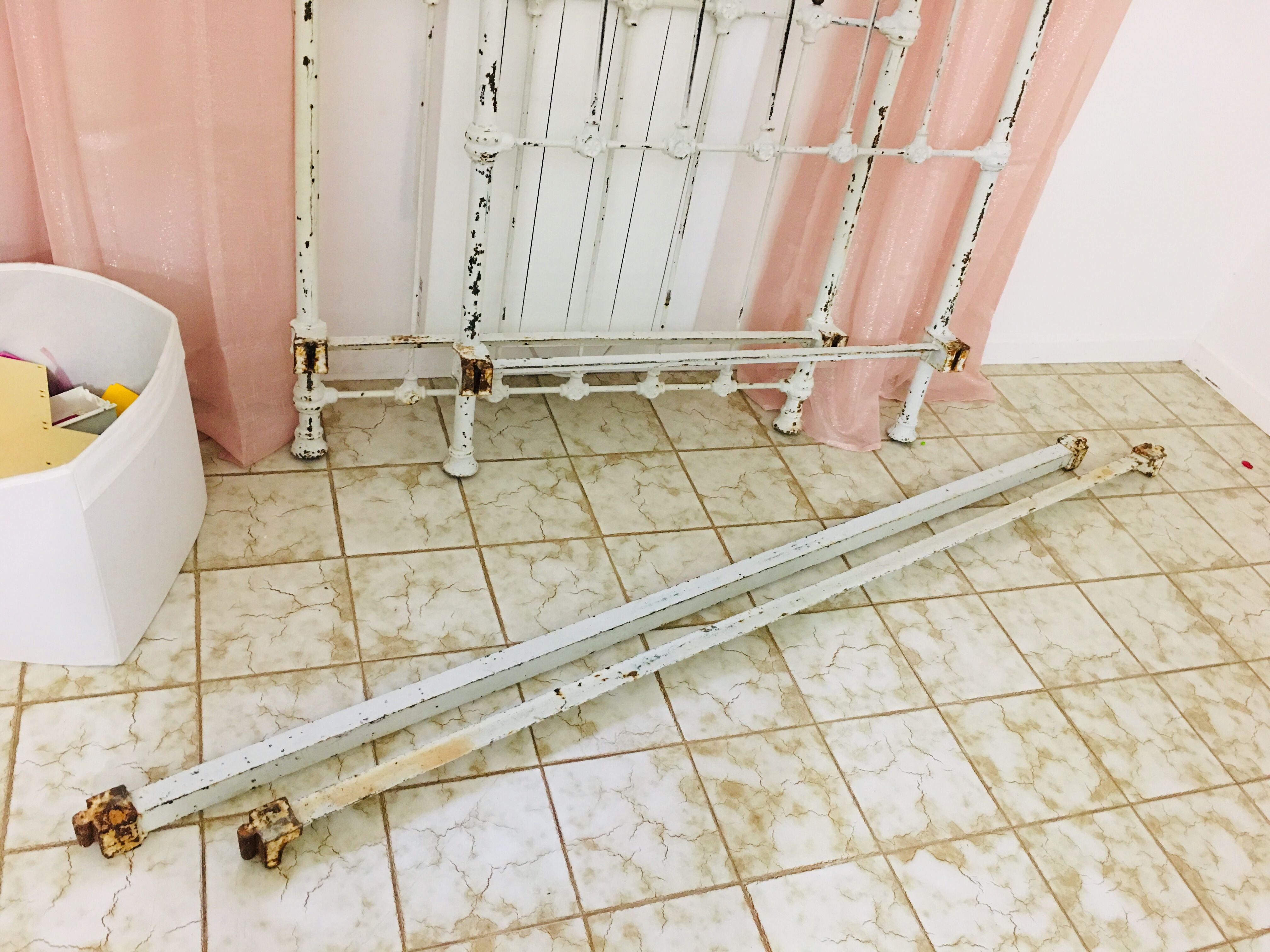 Old white metal and brass bed