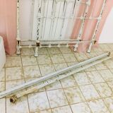 Old white metal and brass bed