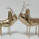 Two stylized zebu with long vintage brass horns