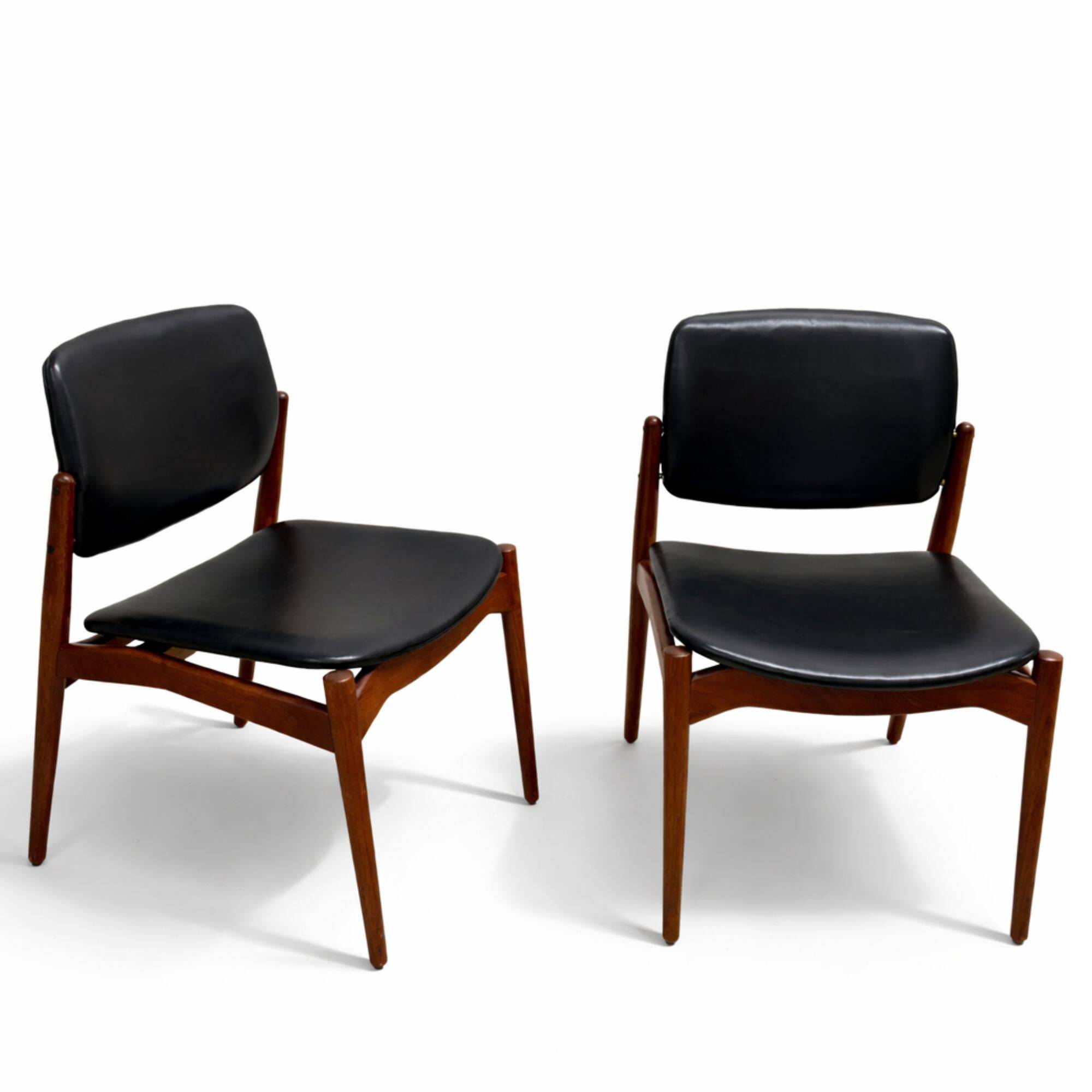 Captain chair pair by Erik Buch