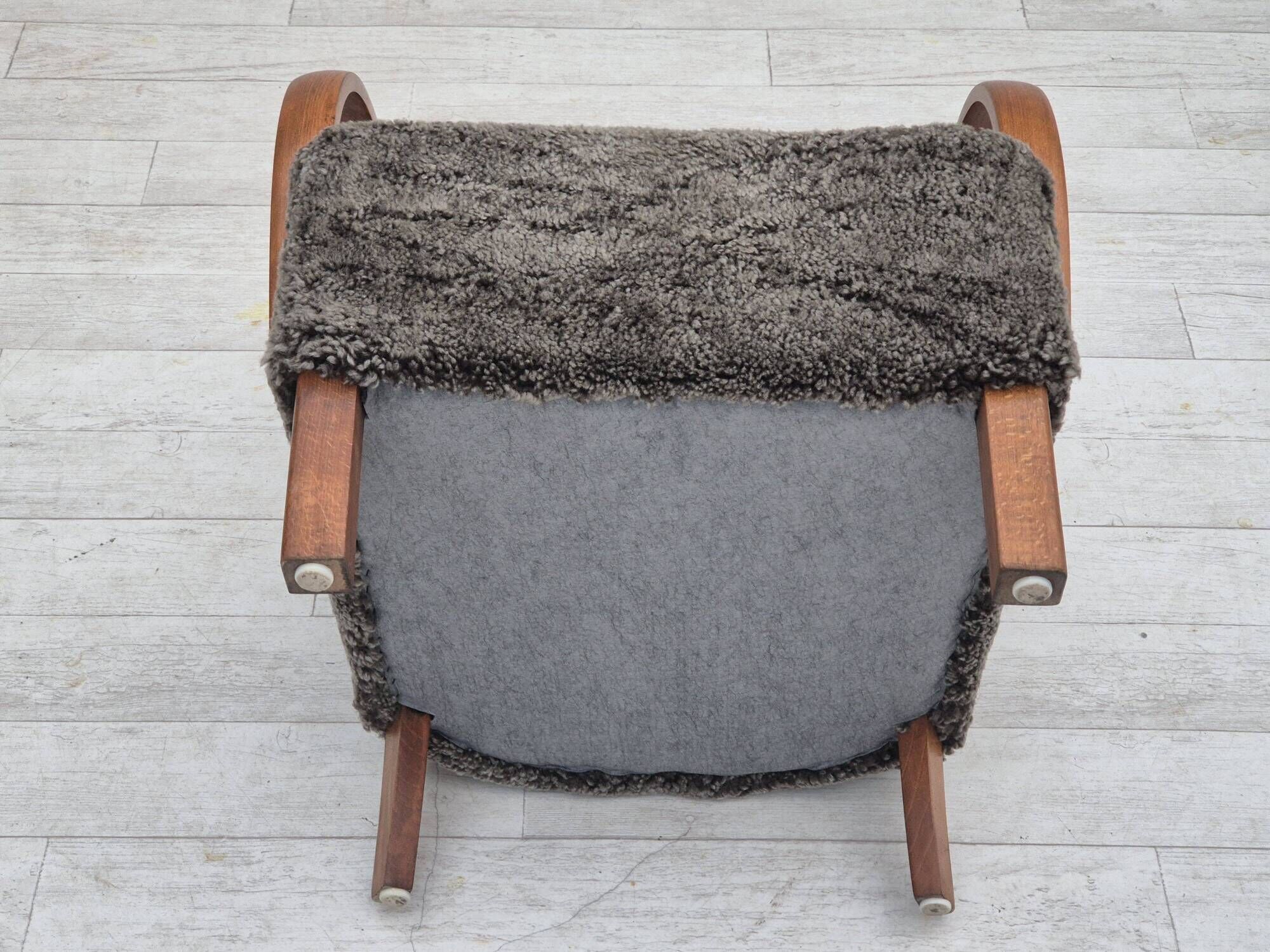 1960s, completely reupholstered Danish art deco armchair, genuine sheepskin "Wellington".