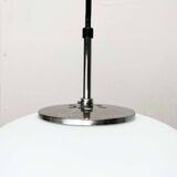 Minimalist suspended glass ball lamp from the vintage German space age by Glashütte Limburg, 1970s.