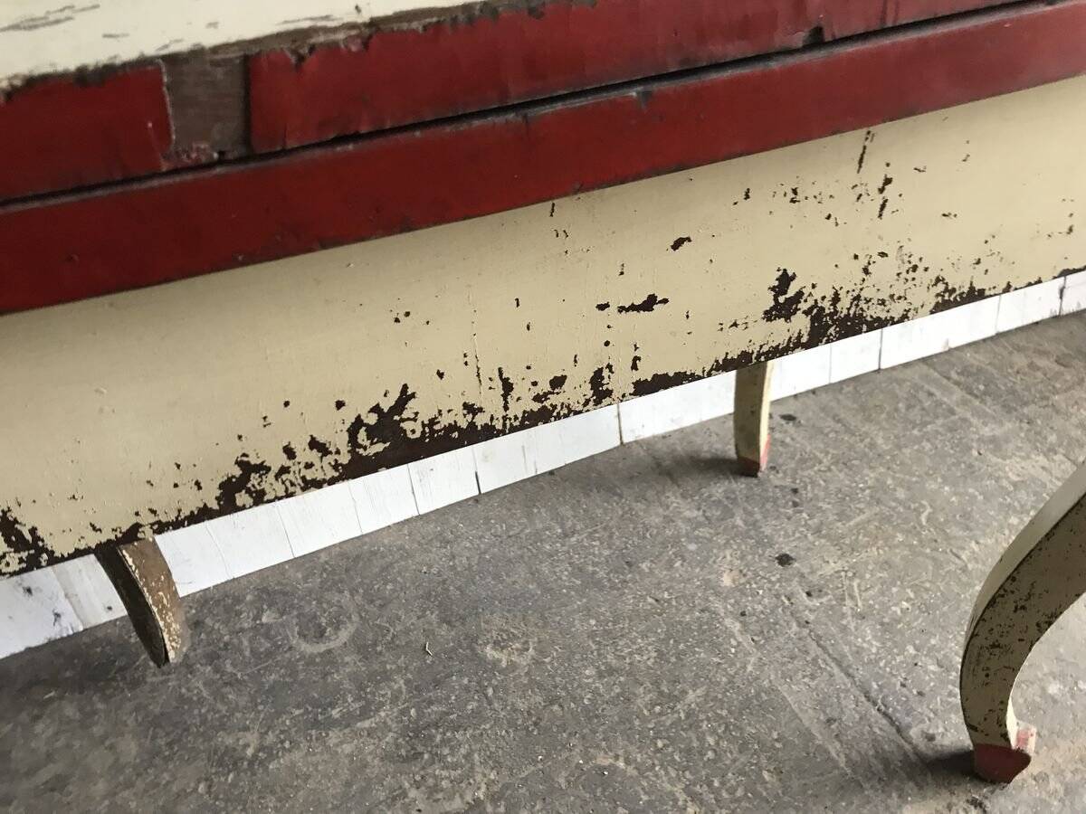 Rustic red and cream wooden dining table, moulded top, 1950s.