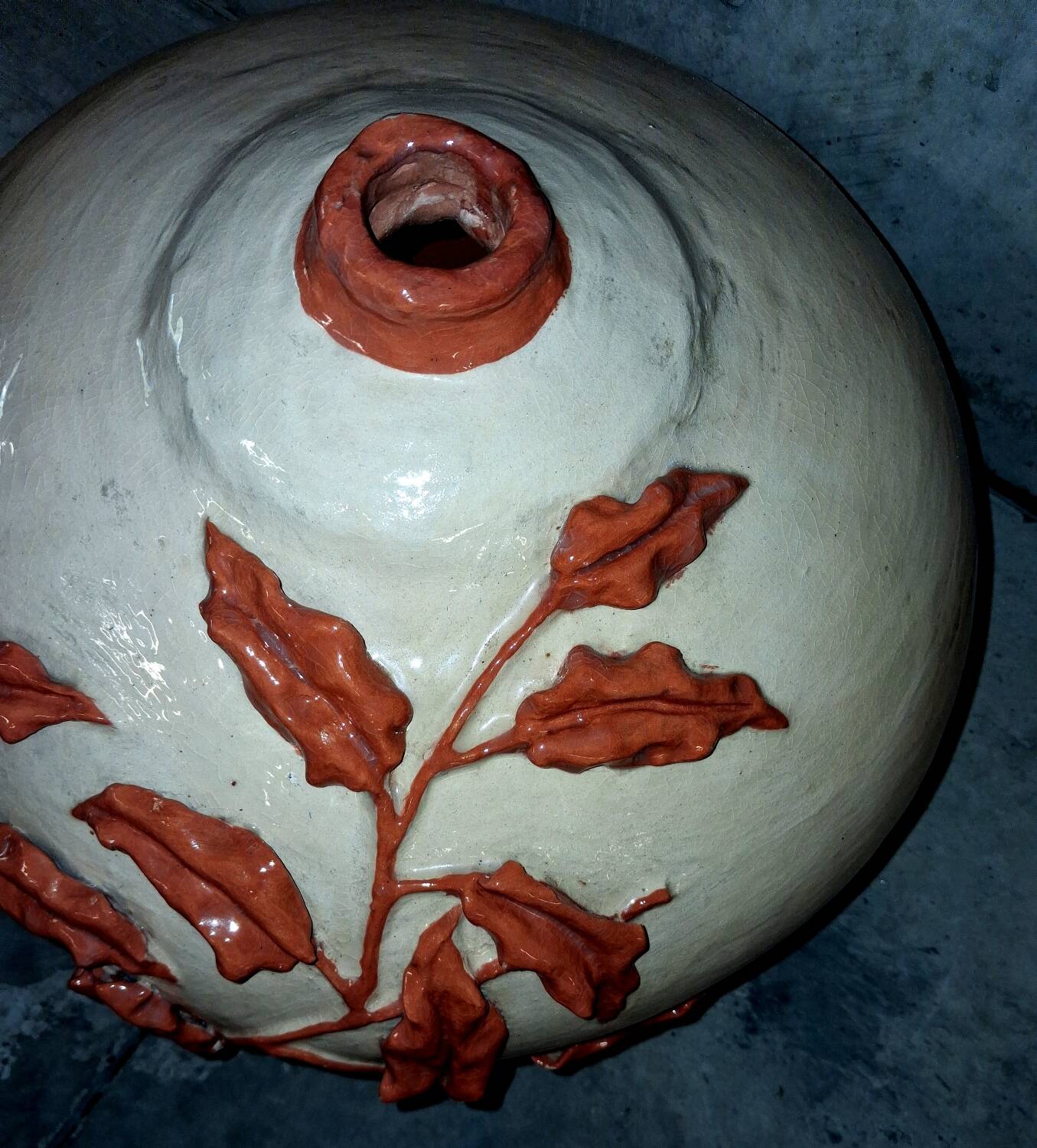 Large vase with relief plant decoration, raw art.