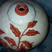 Large vase with relief plant decoration, raw art.
