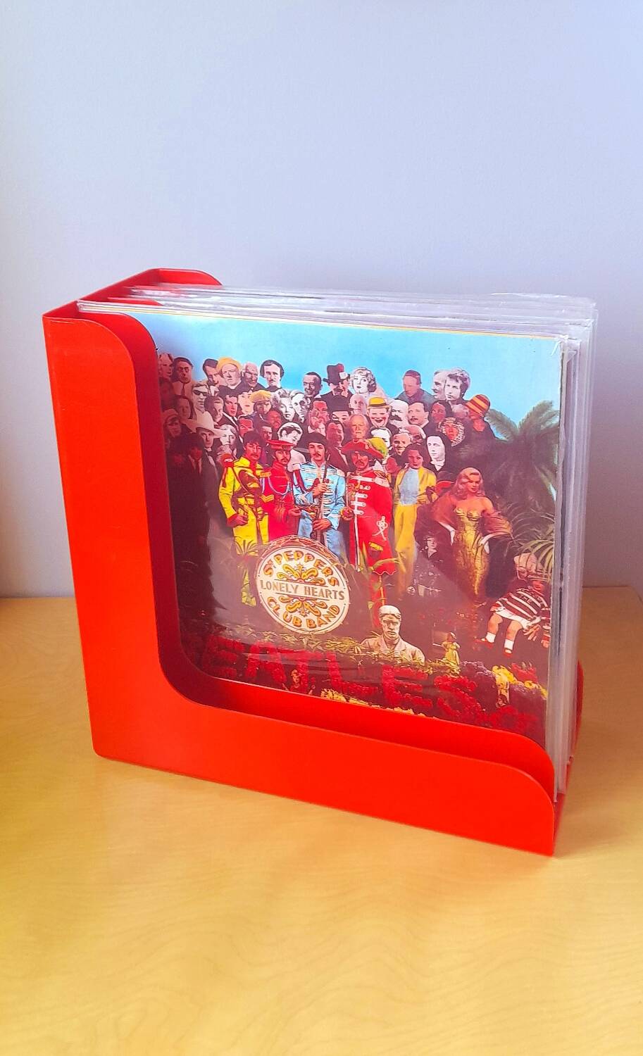 33 rpm vinyl record rack, in orange 70s plastic.