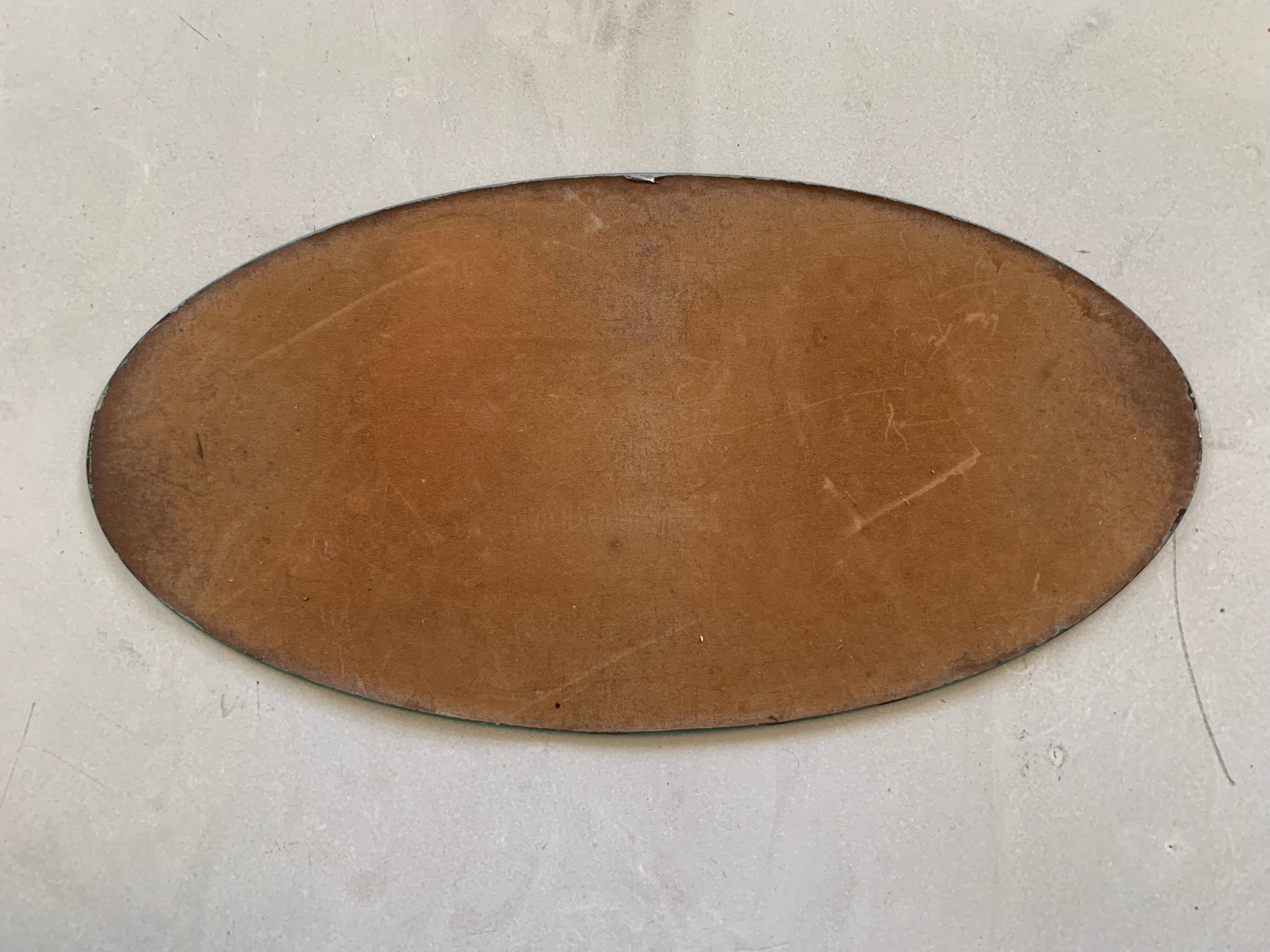Old beveled oval mirror