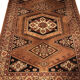 Wool carpet with oriental decoration on a brown background