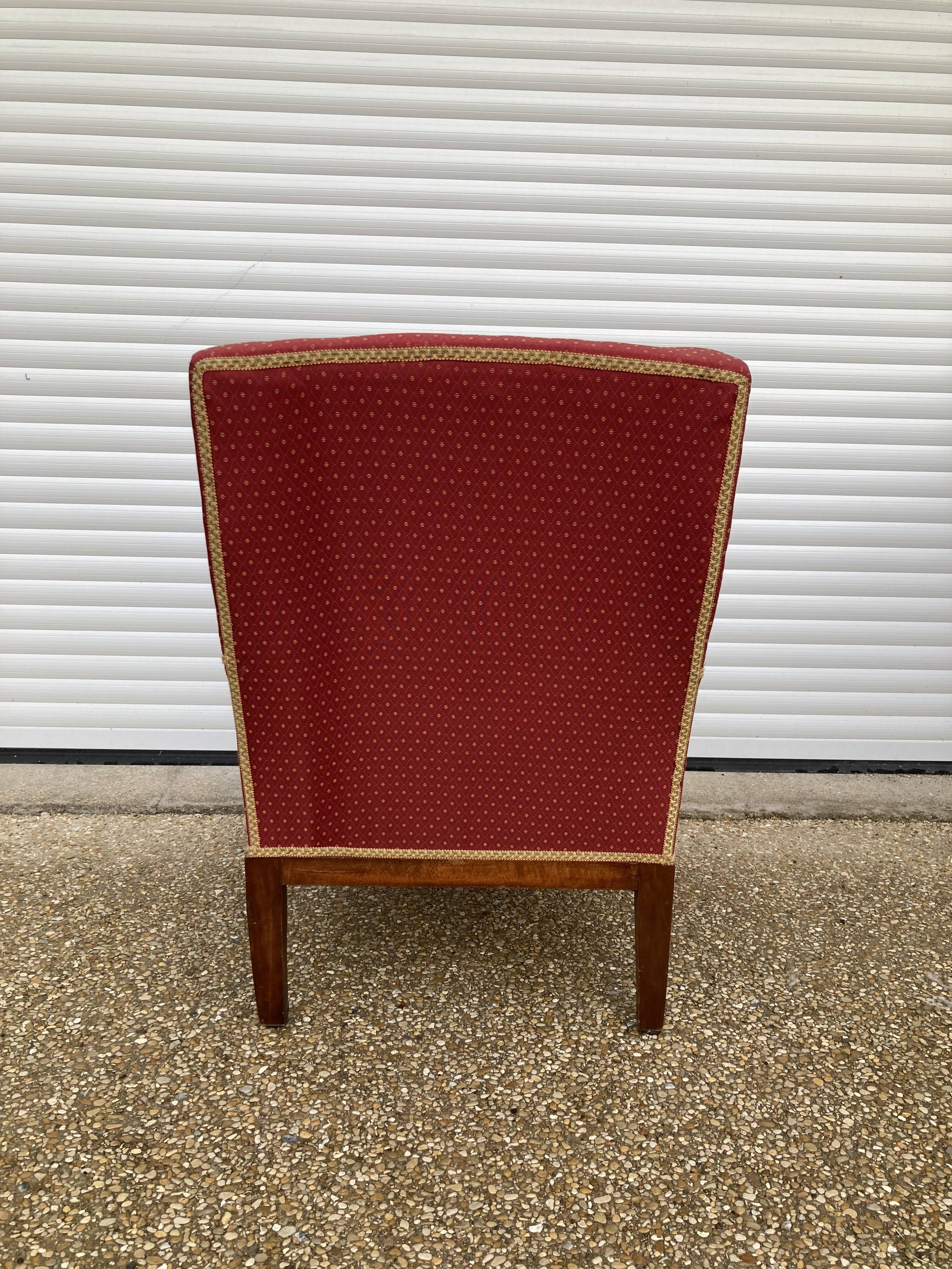 Antique upholstered armchair