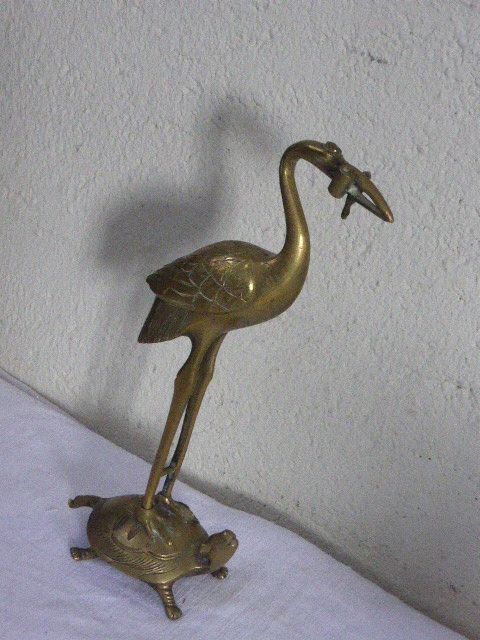 Heron in brass on the back of a turtle, press paper, vintage 1970