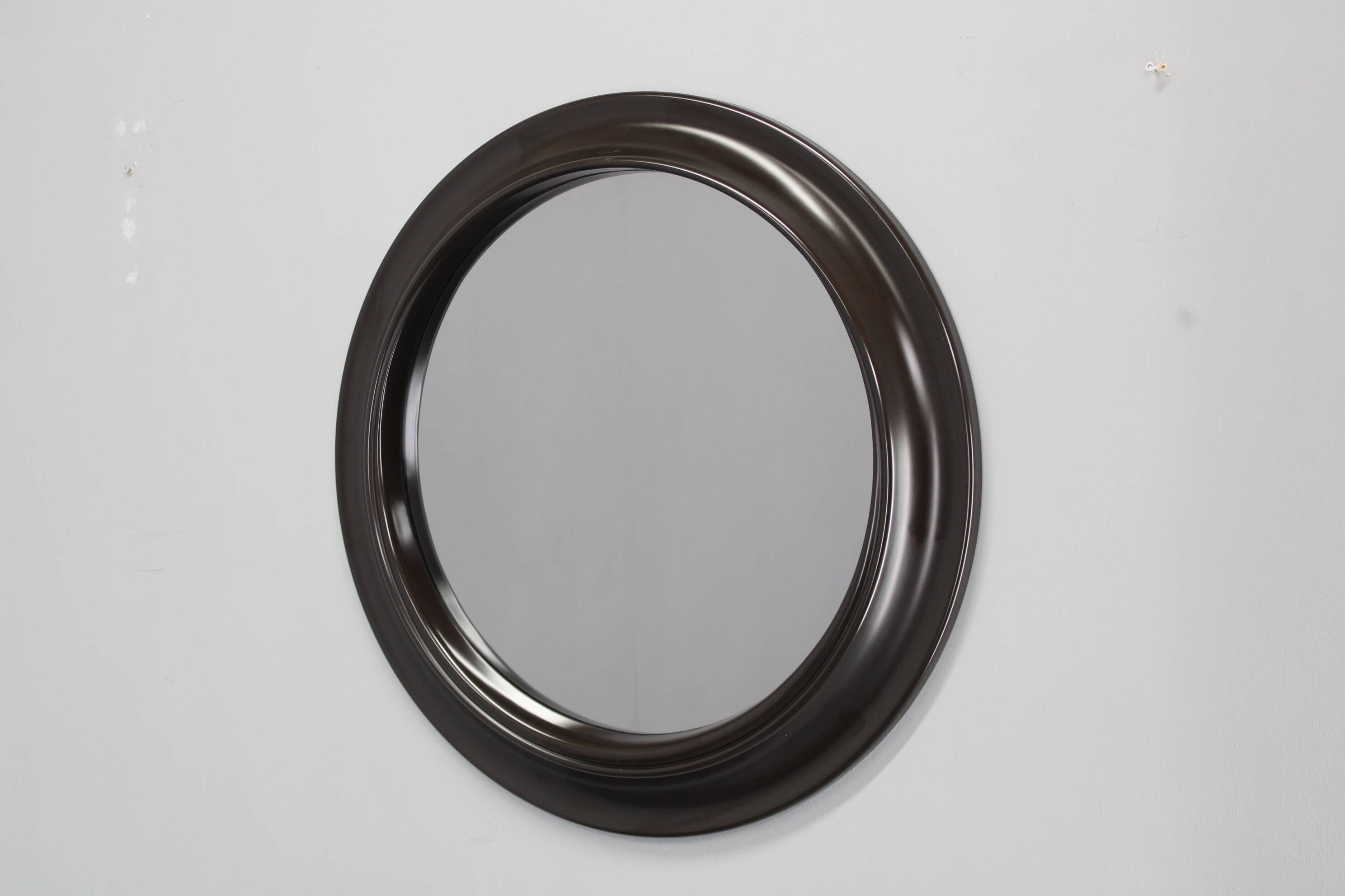 1970s Italian round mirror in dark brown plastic frame