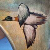 Oval mirror in duck pattern frame