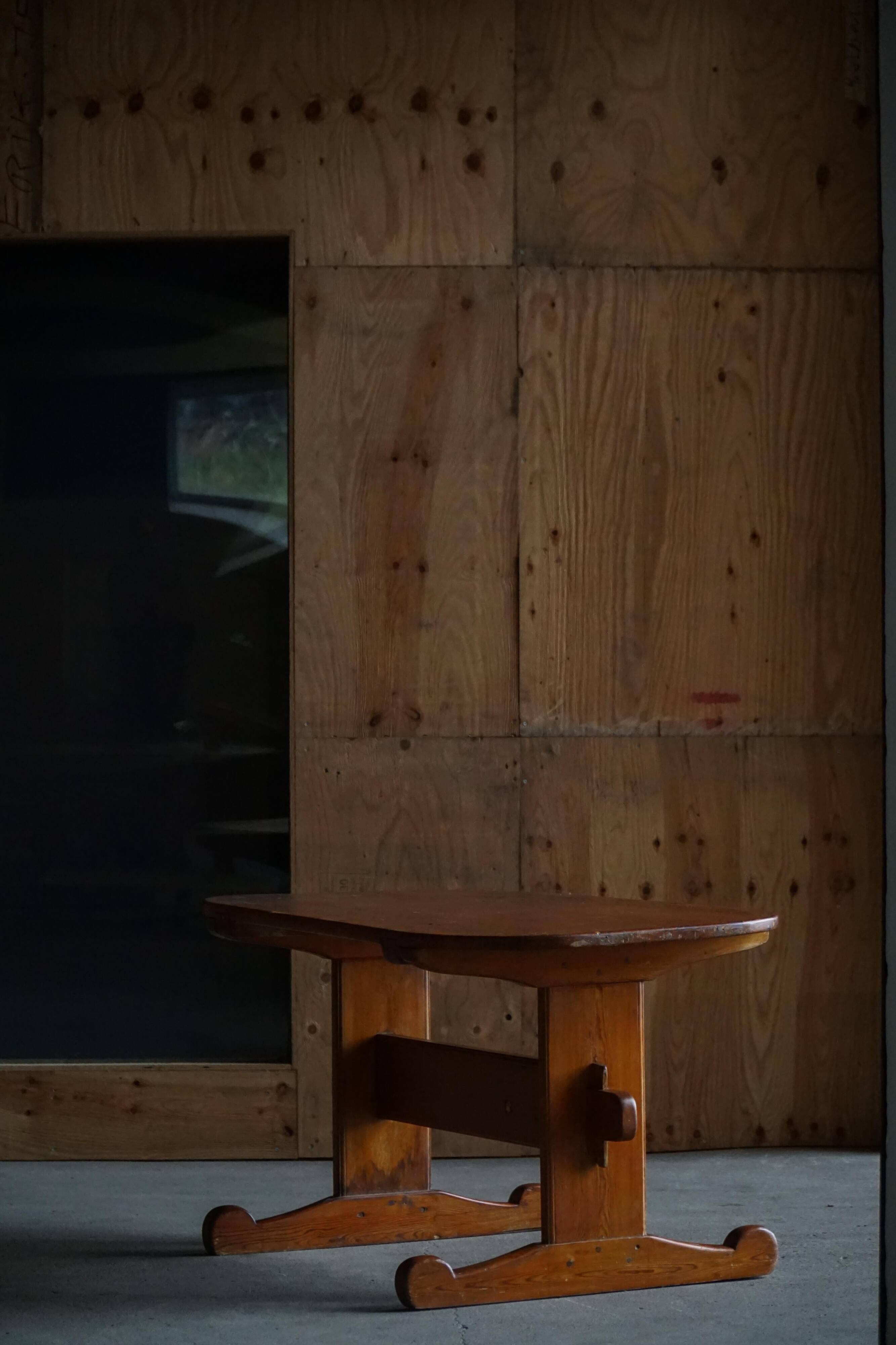 Primitive Swedish oval dining table in pine, early 20th century.