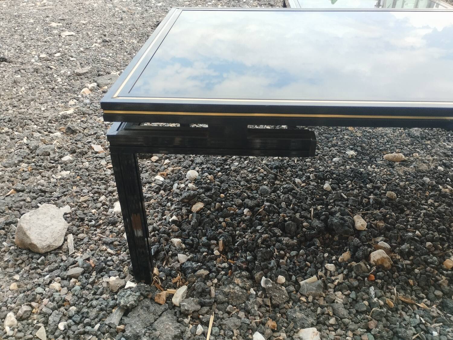 Vintage metal coffee table with glass top.