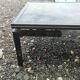 Vintage metal coffee table with glass top.
