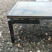 Vintage metal coffee table with glass top.