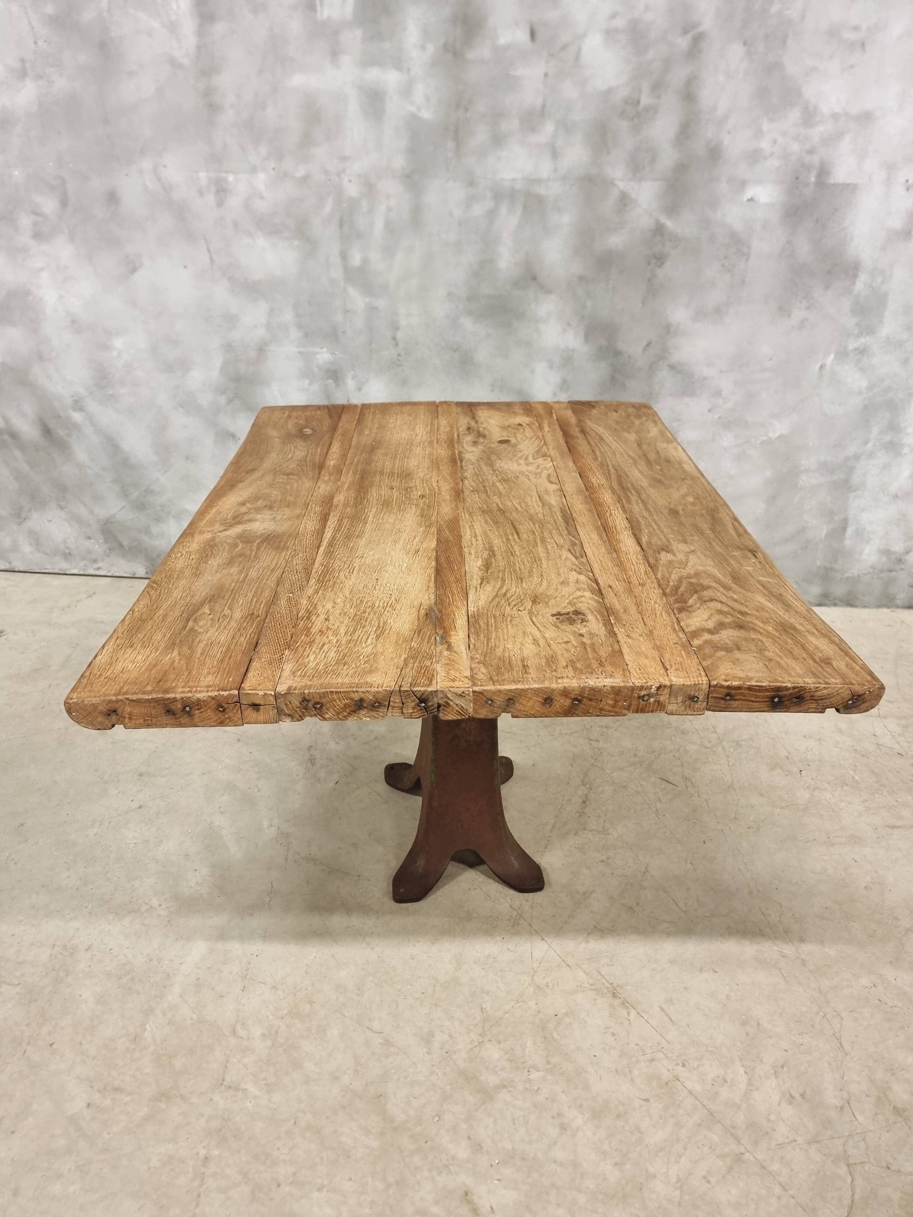 Antique oak dining table on cast iron base 93 x 123 cm