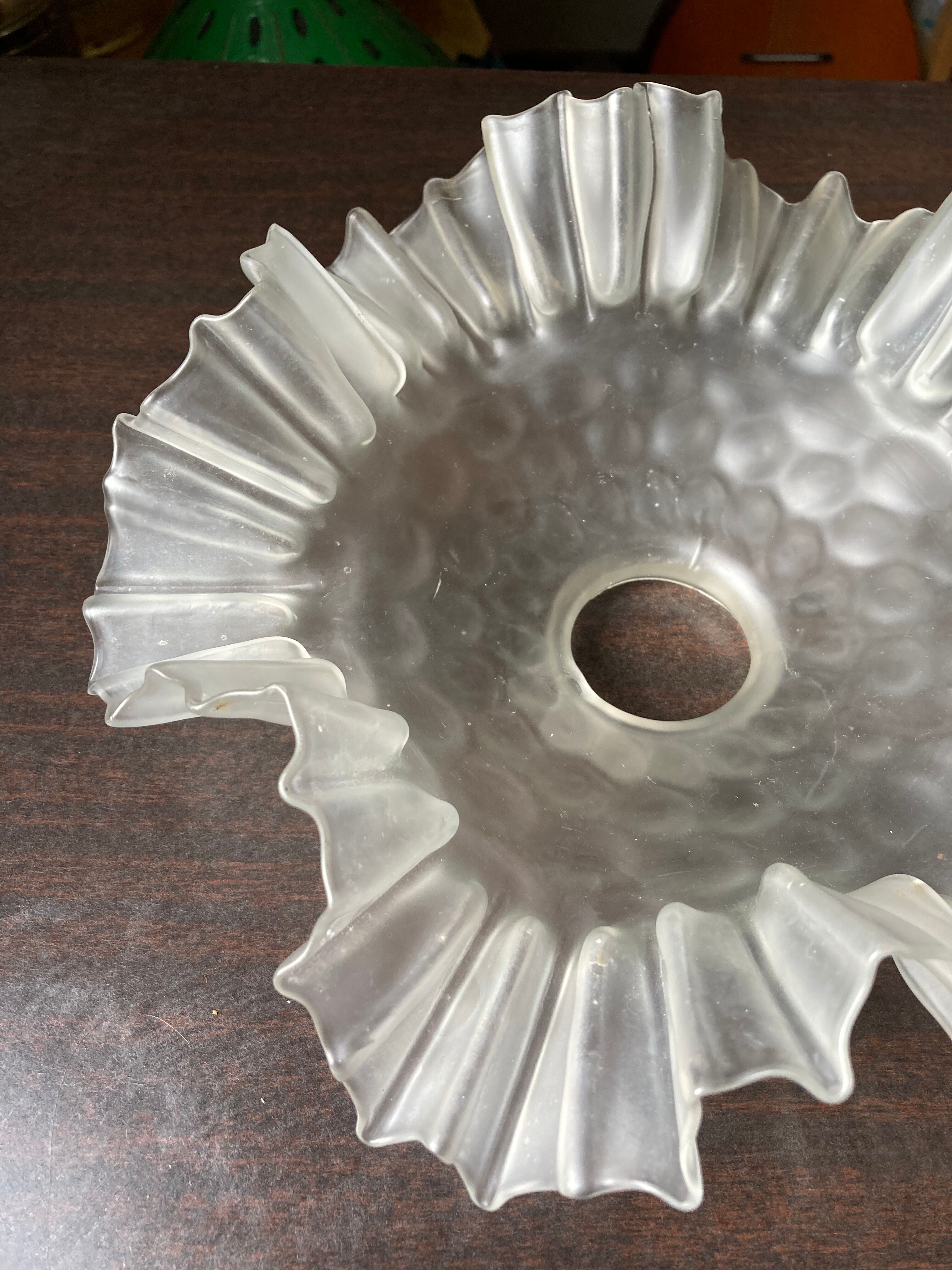 Transparent molded glass suspension in flower shape