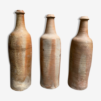 Trio of natural sandstone bottles