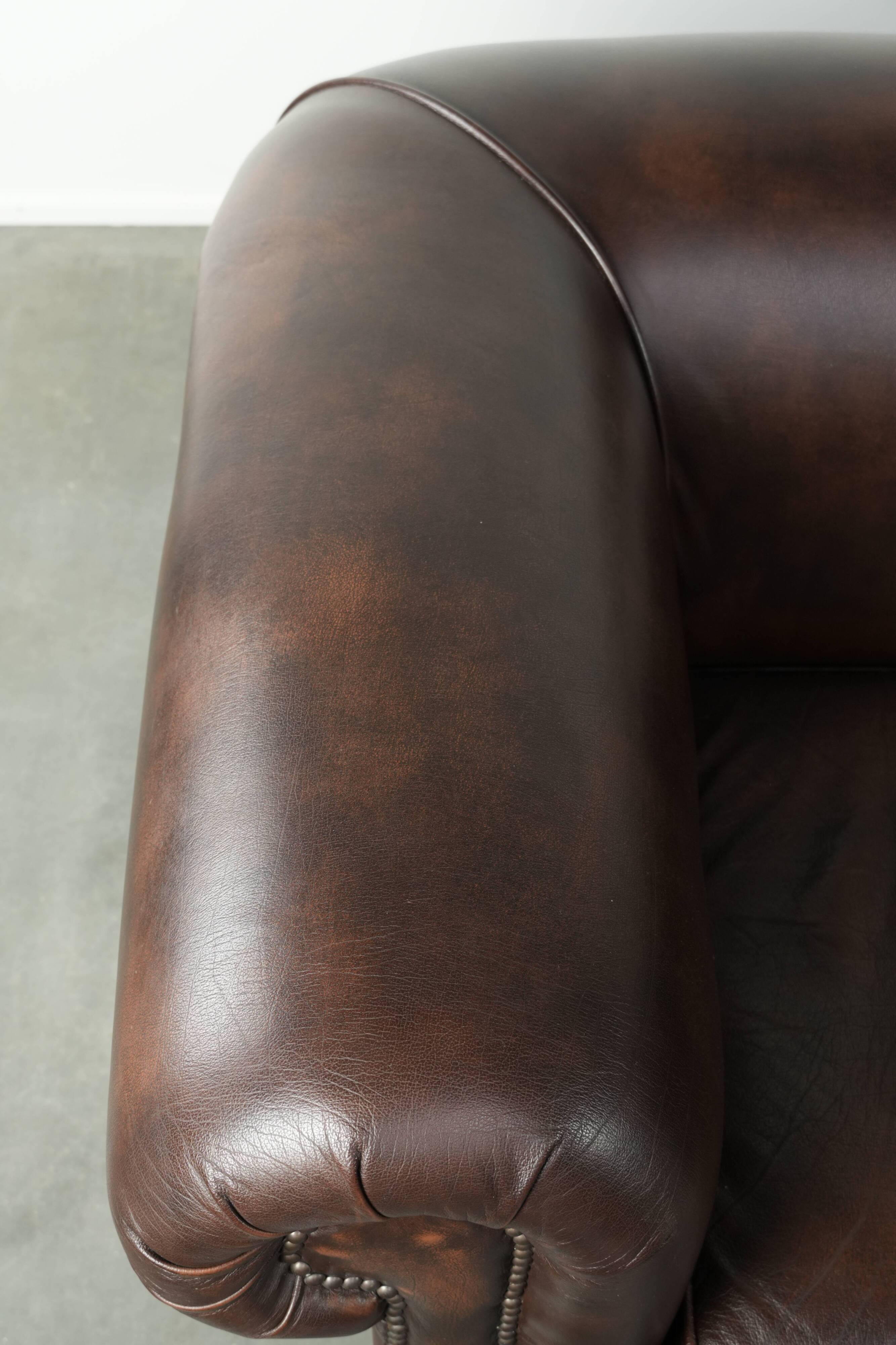 Luxury brown smooth cow leather Chesterfield sofa with an English look