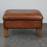 English-style leather ottoman in cognac-colored leather