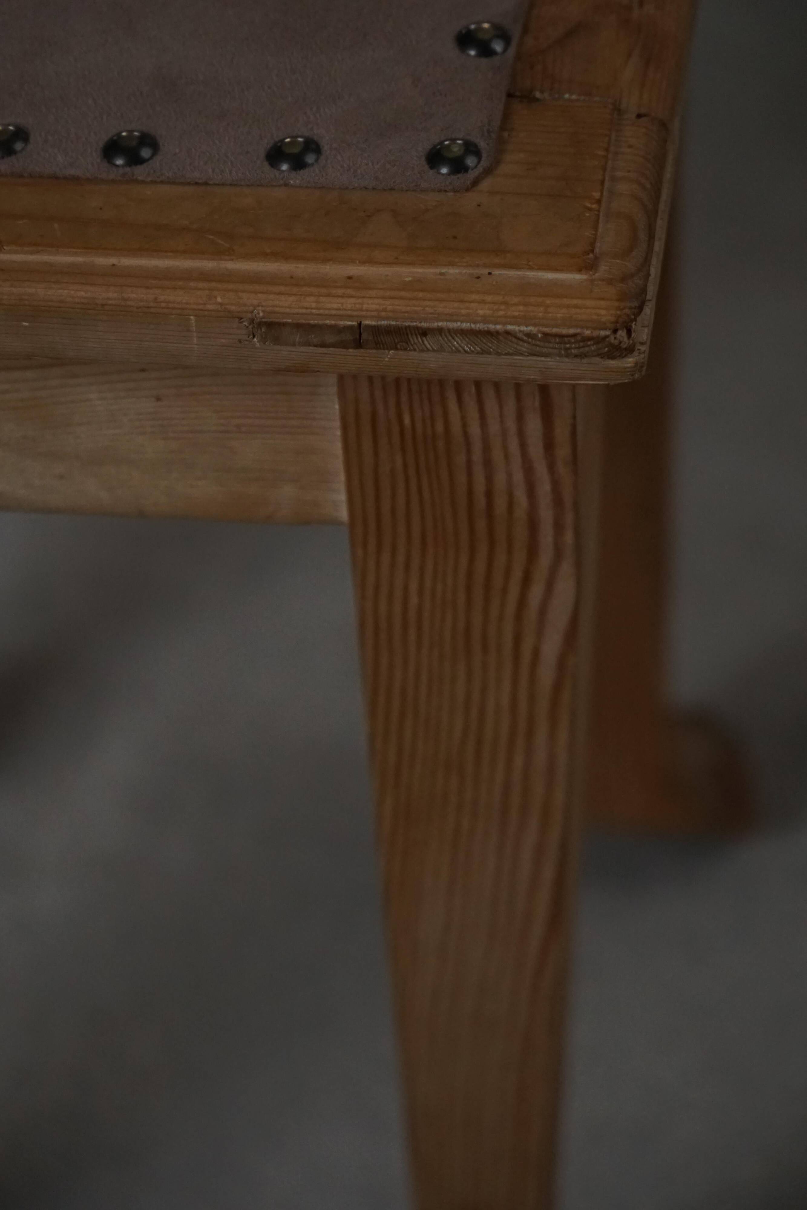 A pair of antique Danish pine stools from the late 19th century.