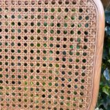 Wooden chair with caning in the style of Marcel Breuer.