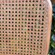Wooden chair with caning in the style of Marcel Breuer.