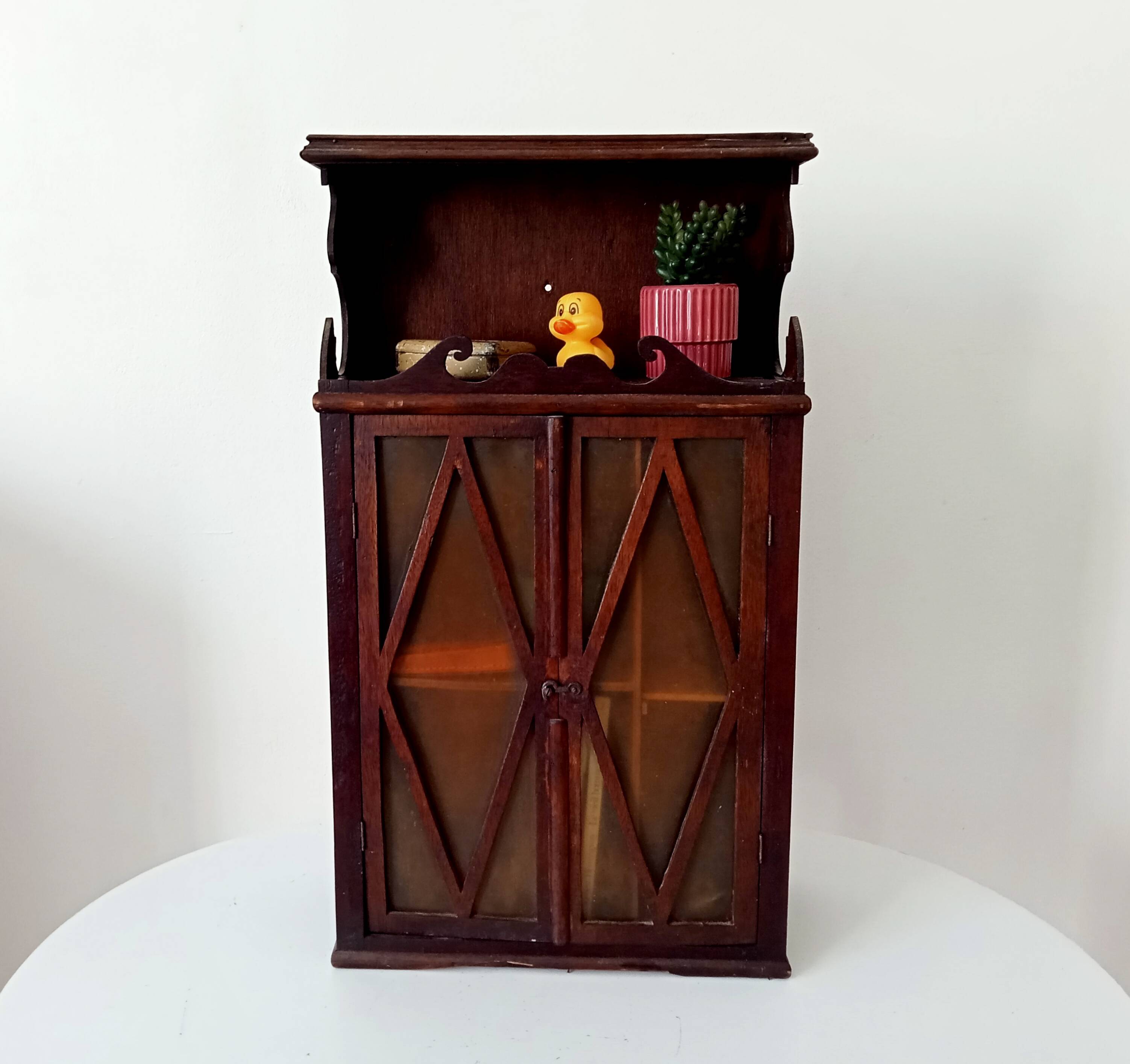 Small antique wall cabinet in Gothic style.