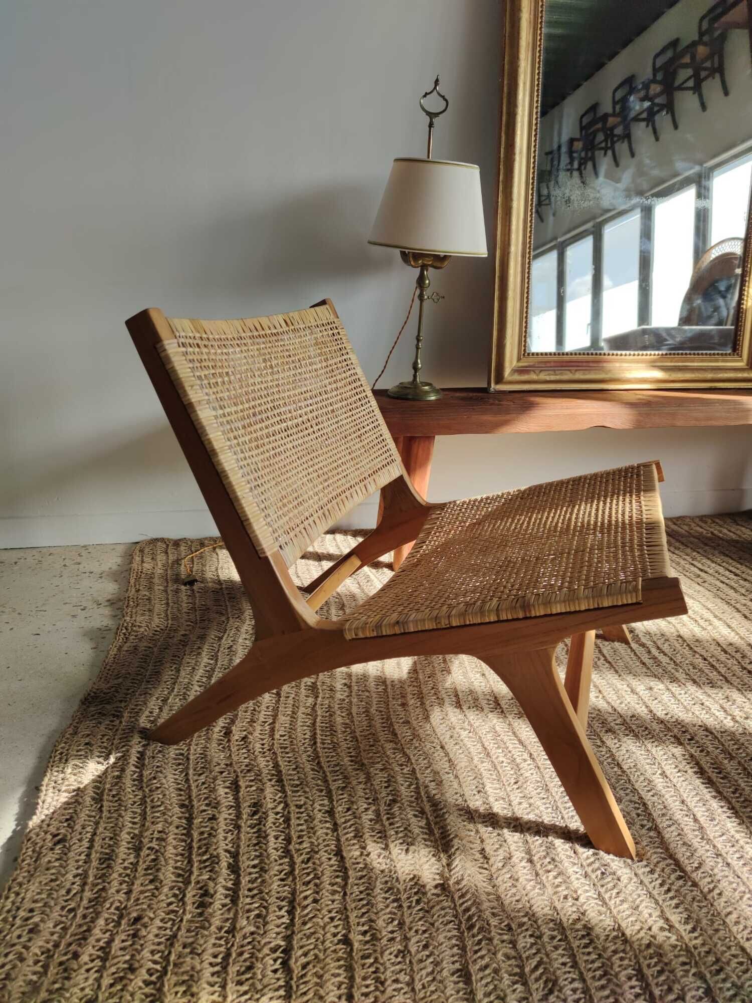 Reclining armchair in natural wood and woven rattan