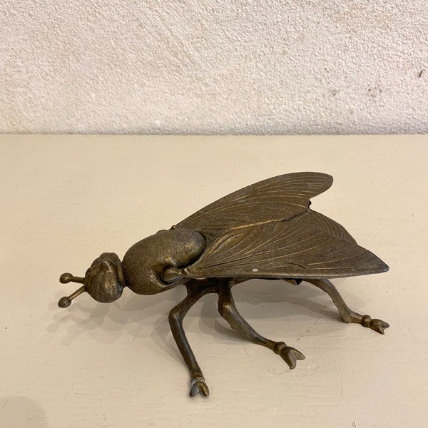 Gold metal ashtray fly