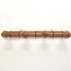 Wall-mounted coat rack in bamboo effect wood
