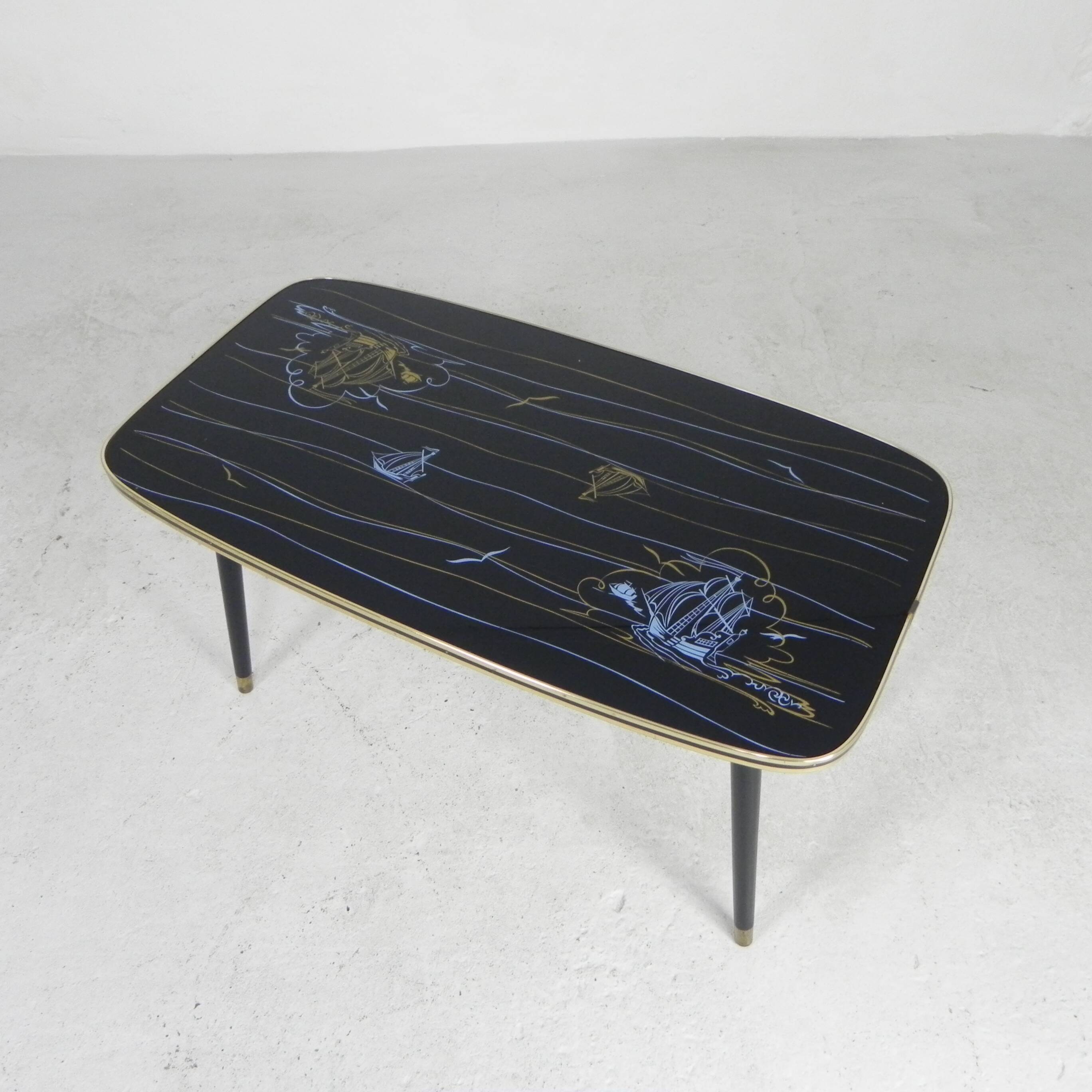 Vintage coffee table with glass top and angled legs