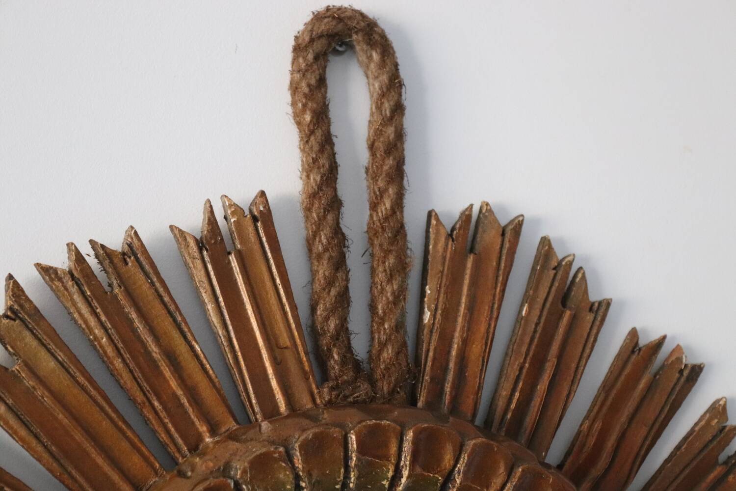 Old large sun mirror in gilded wood