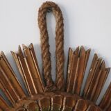 Old large sun mirror in gilded wood