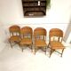 Set of 4 antique chairs in woven red and natural rattan.