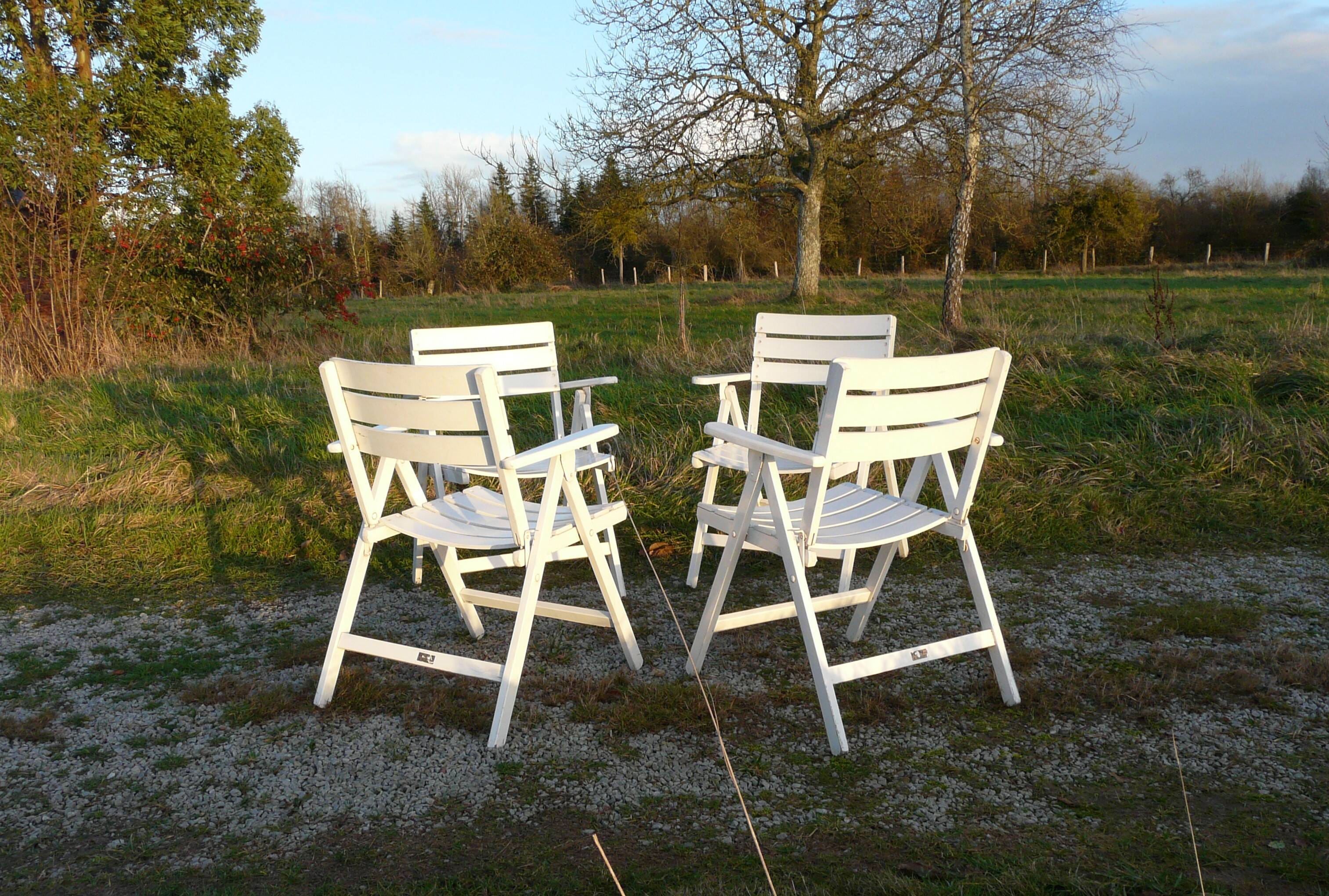 Four vintage wooden garden armchairs from the 1950s