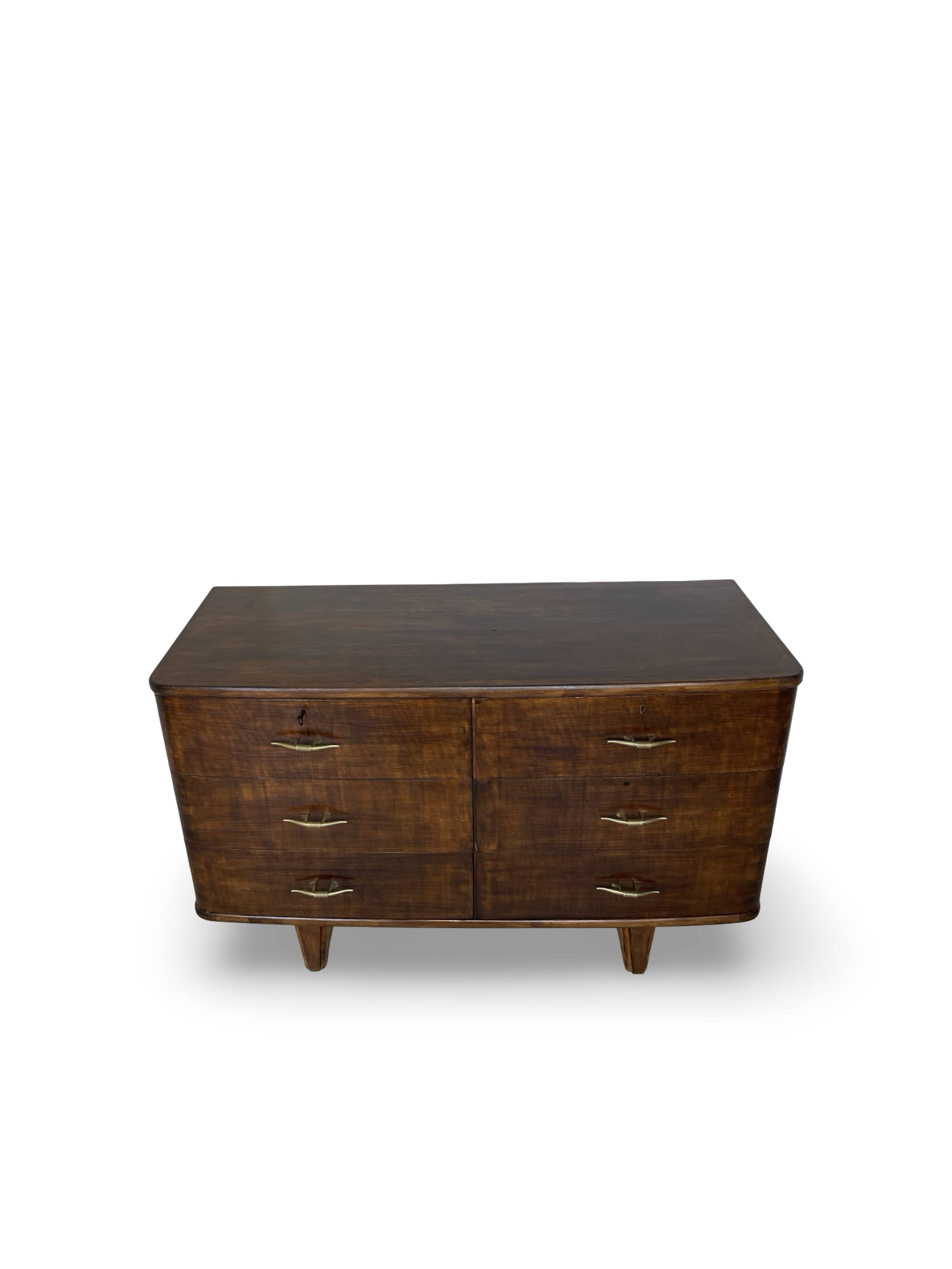 A vintage Italian chest of drawers, made of veneered walnut and solid wood,