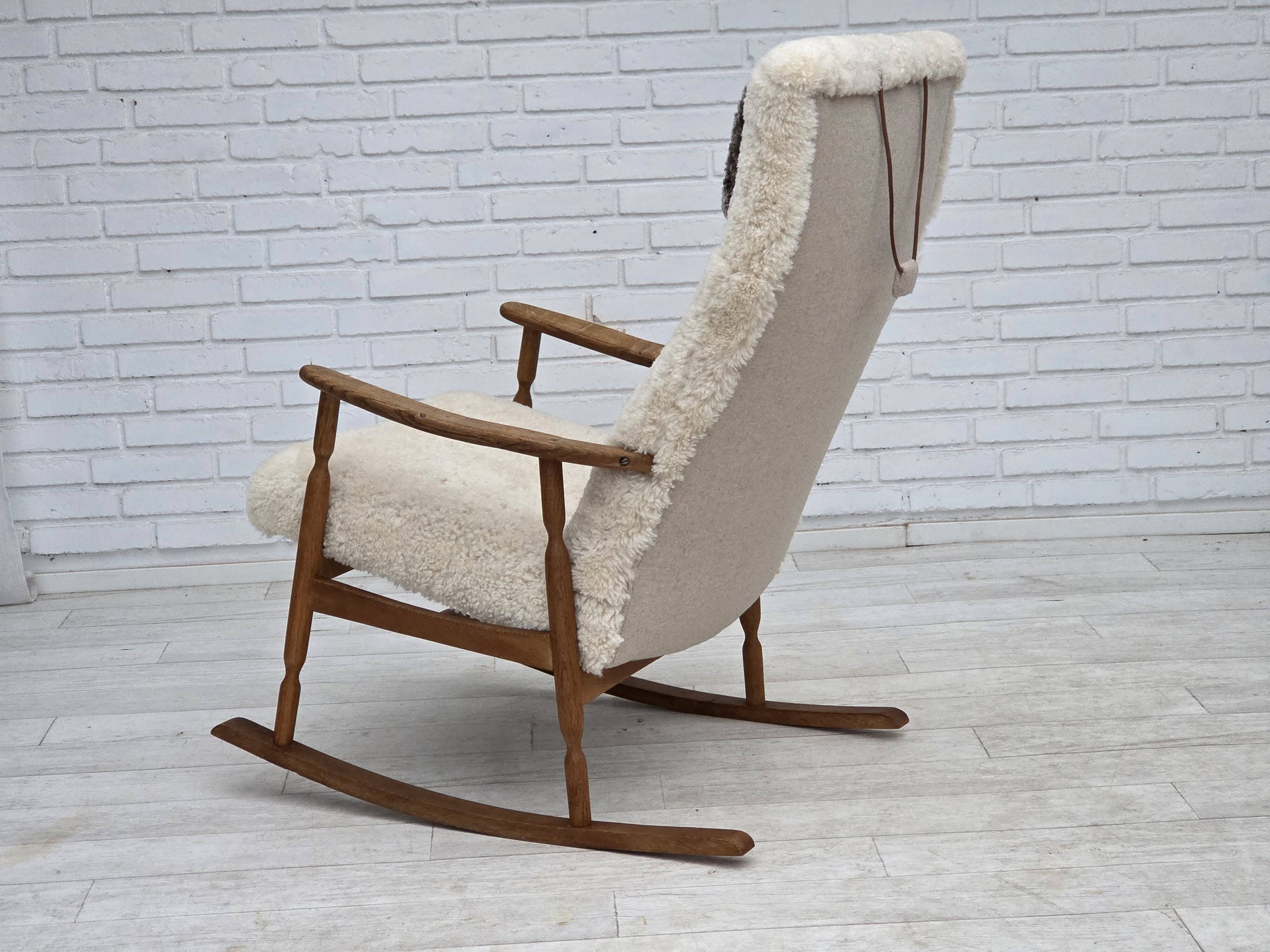 1970s, Danish rocking chair, reupholstered in quality genuine sheepskin.