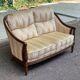 Two-seater Louis XVI canapé in golden beige fabric and curved solid wood.