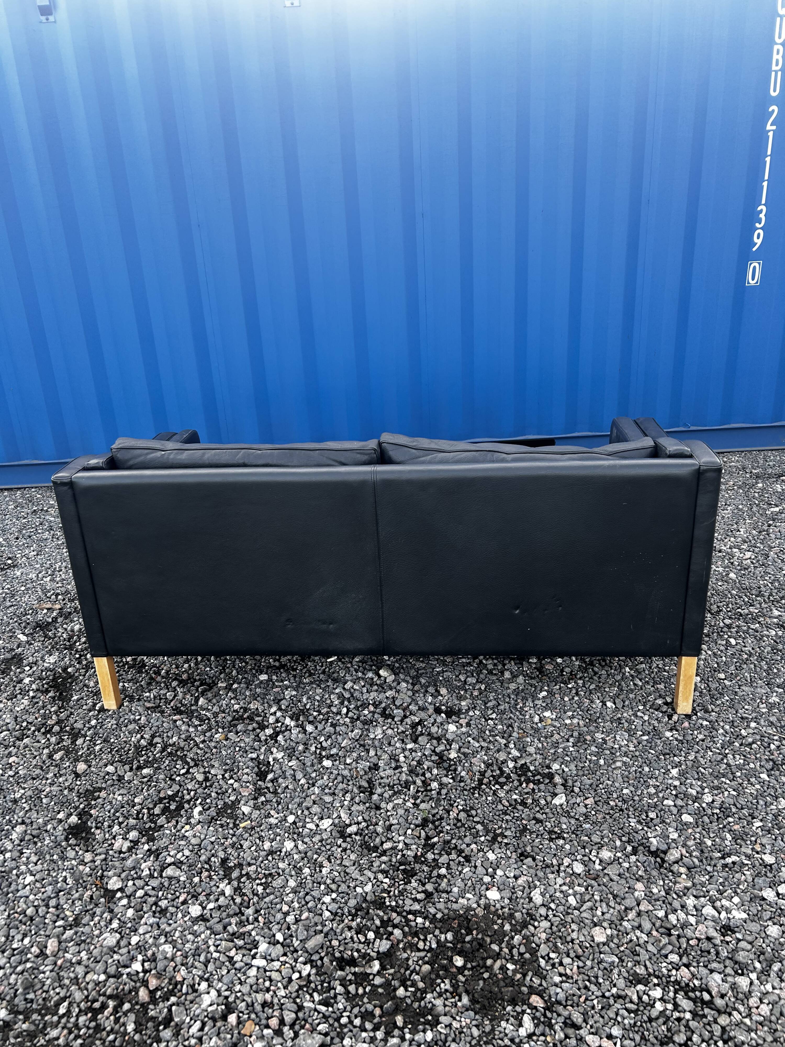 Danish vintage two and half seater black leather Stouby sofa 1960s