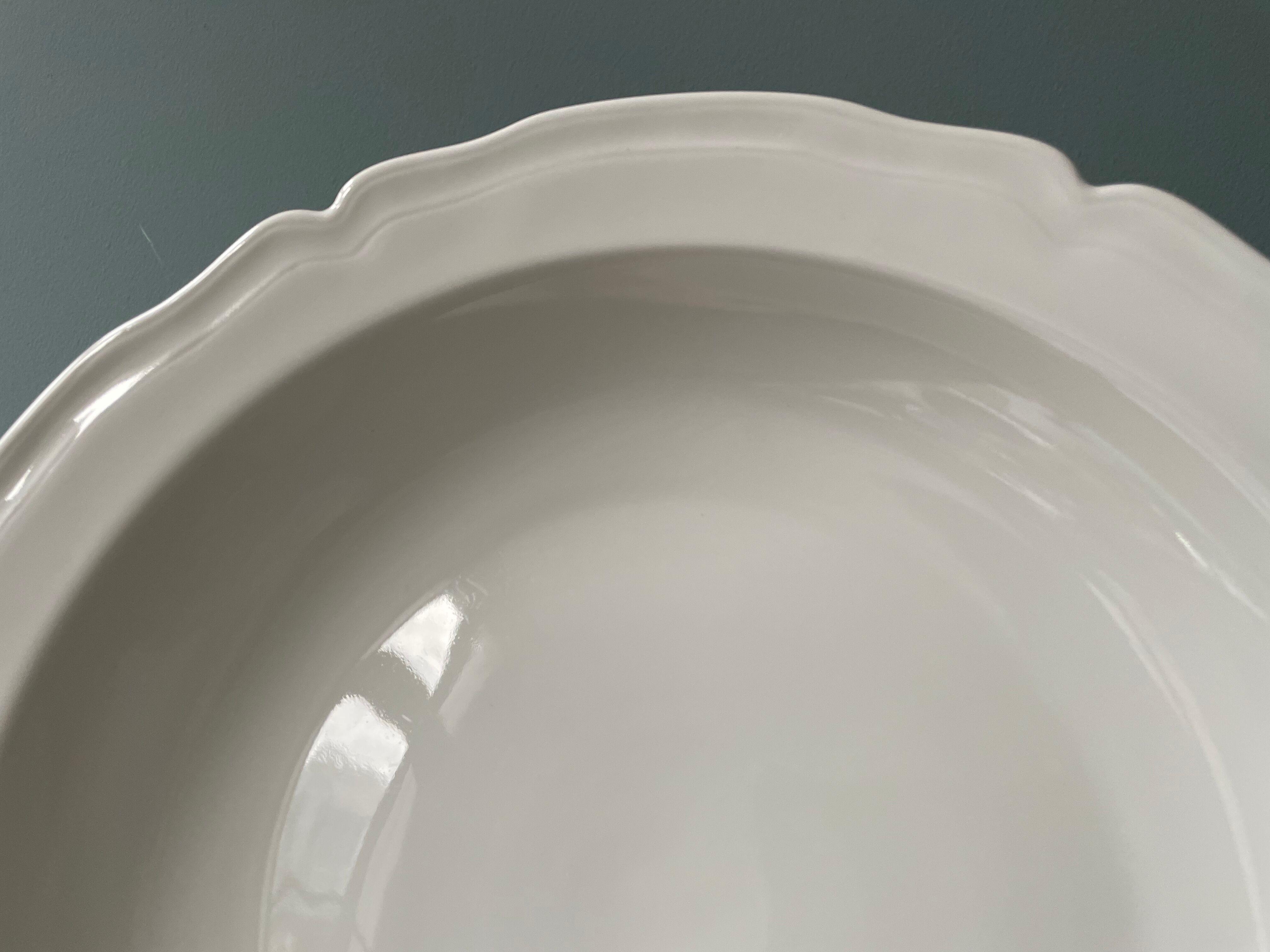 Old hollow round dish in Limoges porcelain