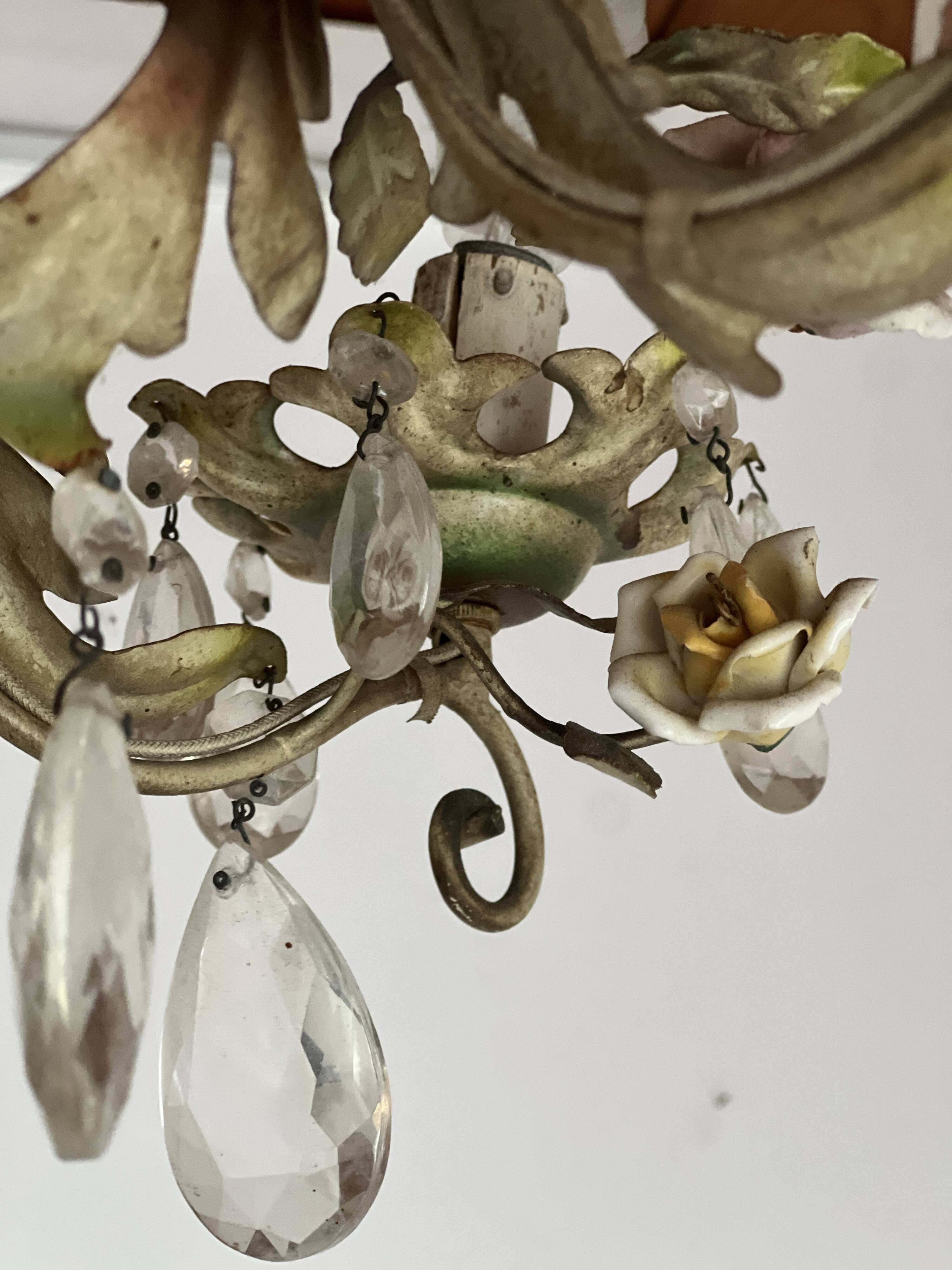 Chandelier with a floral porcelain decoration and pendants