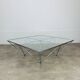 Pyramidal coffee table in chrome-plated steel wire and glass in the style of Piva