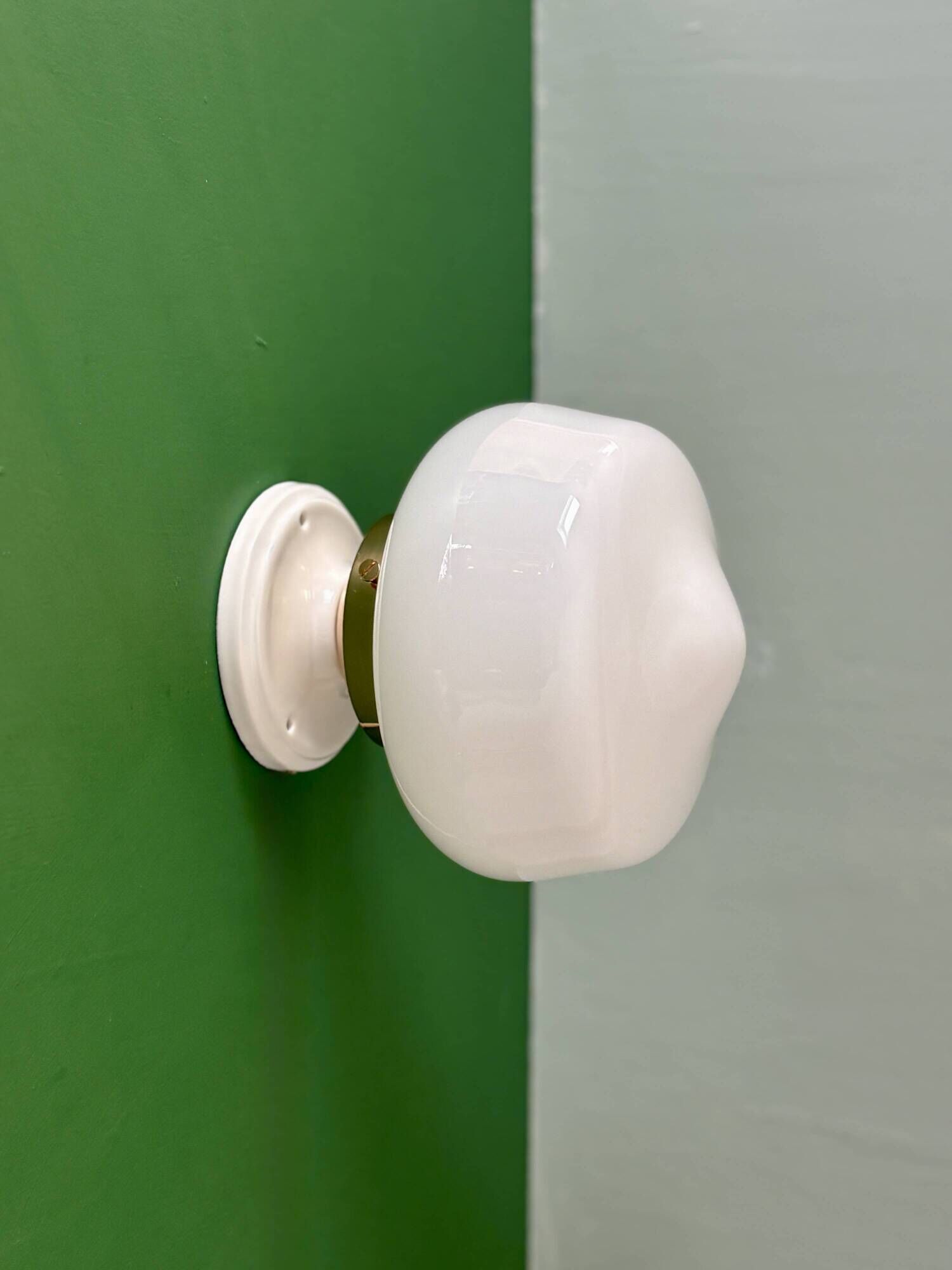 Vintage Art Deco globe wall light in white opaline.