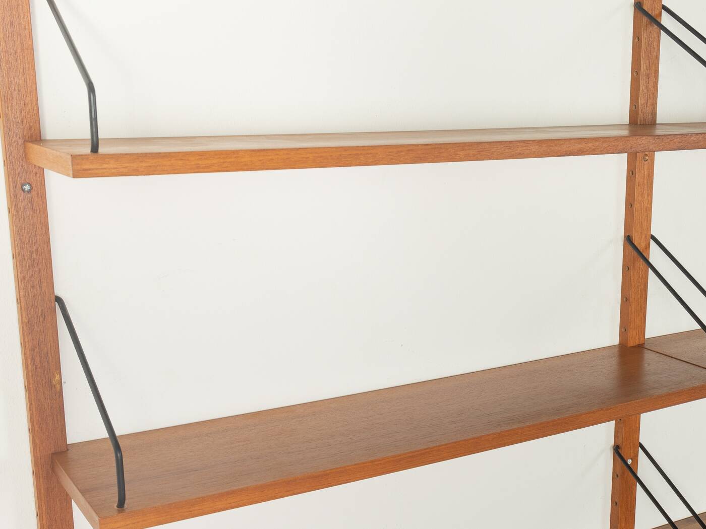 Classic shelving system from the 1950s in teak veneer by Poul Cadovius for Cado