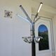 Chrome parrot coat rack with swivel head on a gas lift.