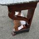 Mahogany console with grey marble top and lion paw feet.
