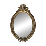 19th century oval gilded mirror, torch & quiver 106cm