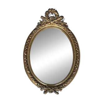 19th century oval gilded mirror, torch & quiver 106cm